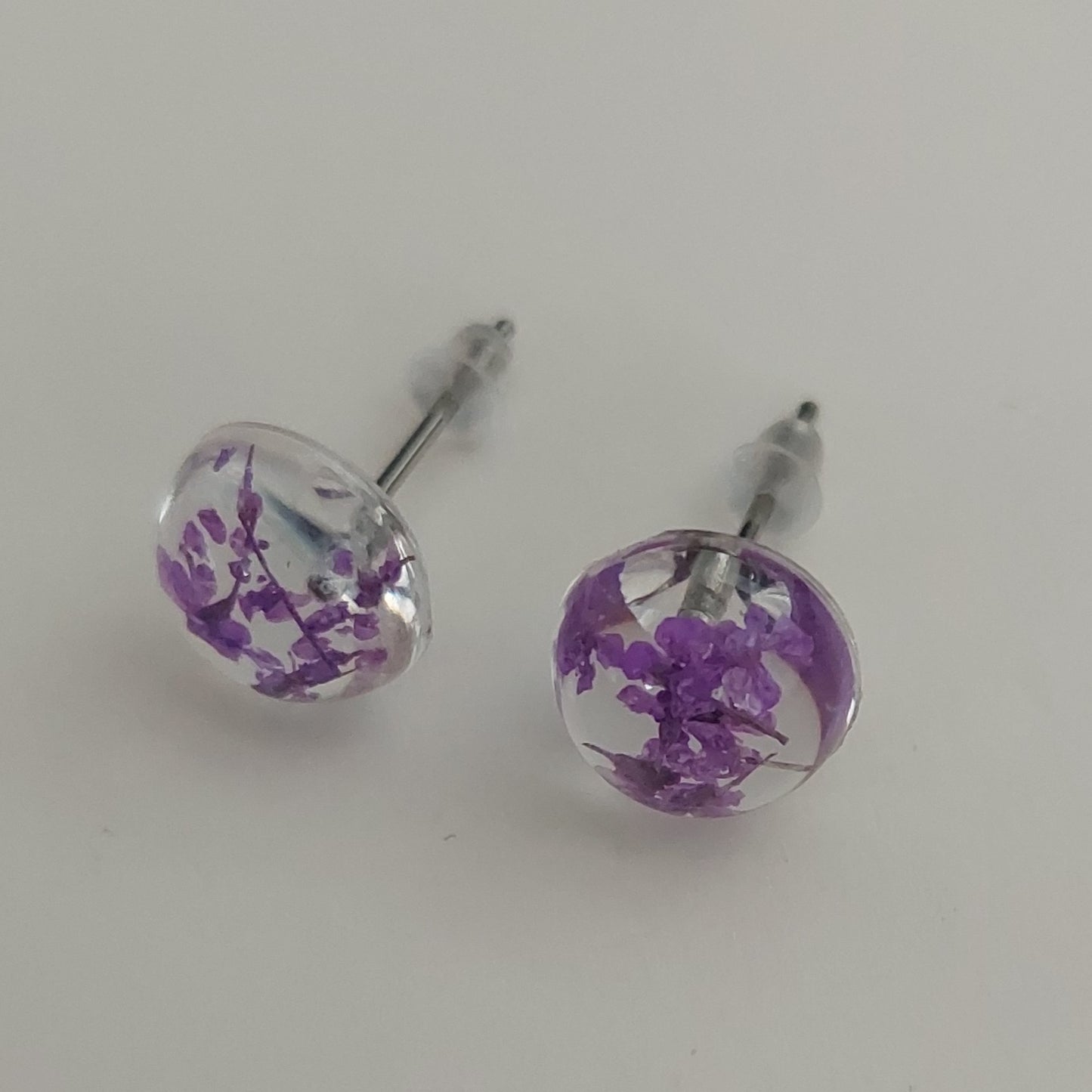 Stud earrings purple color