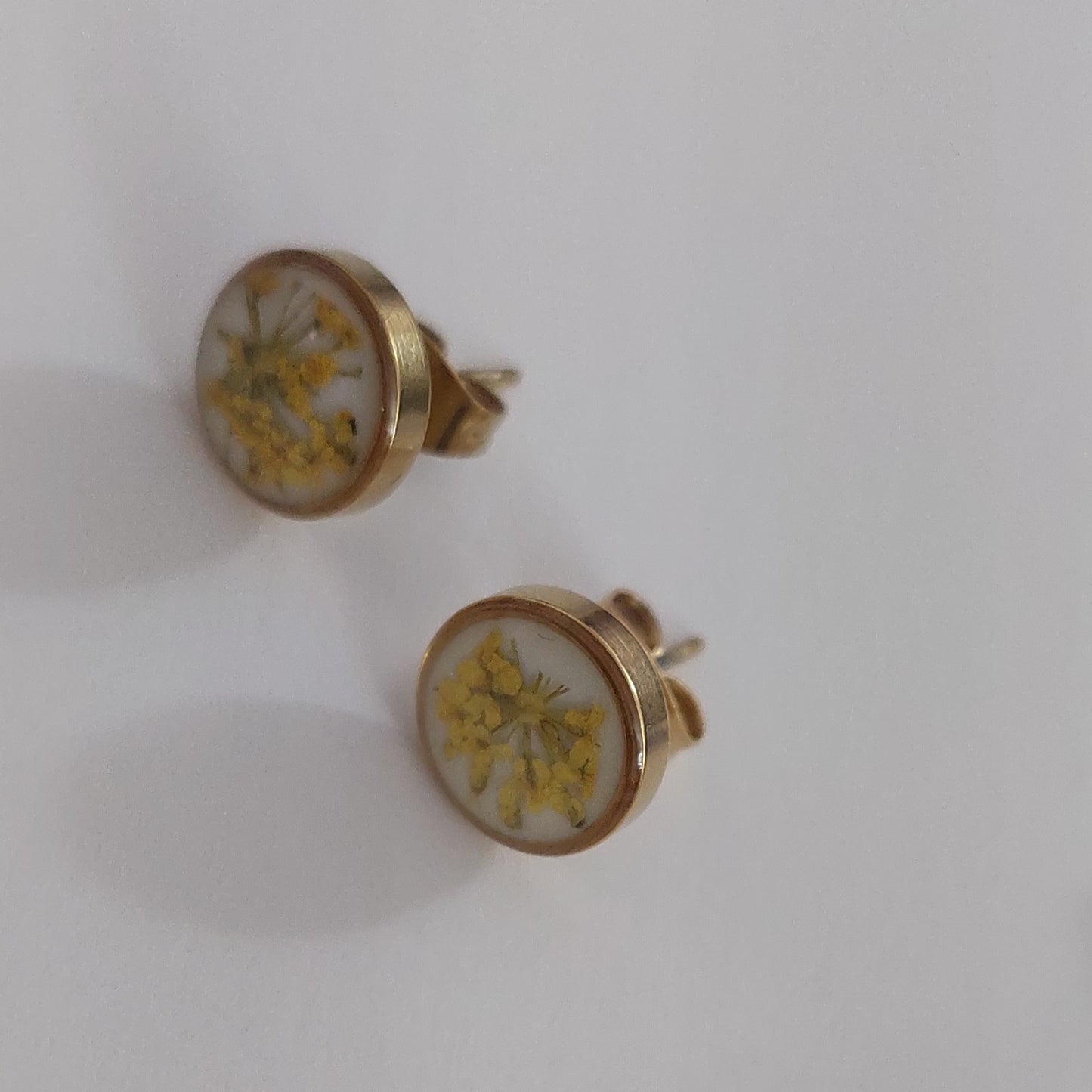 Stud earrings yellow color